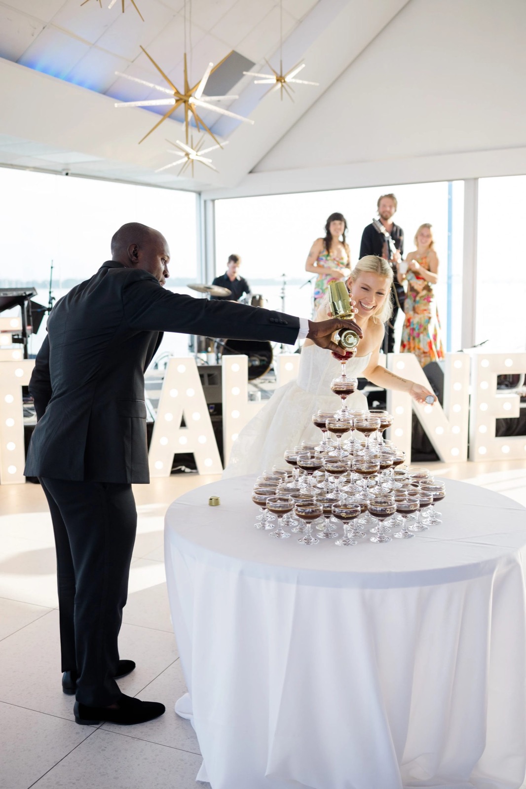 Bride pouring a champagne tower